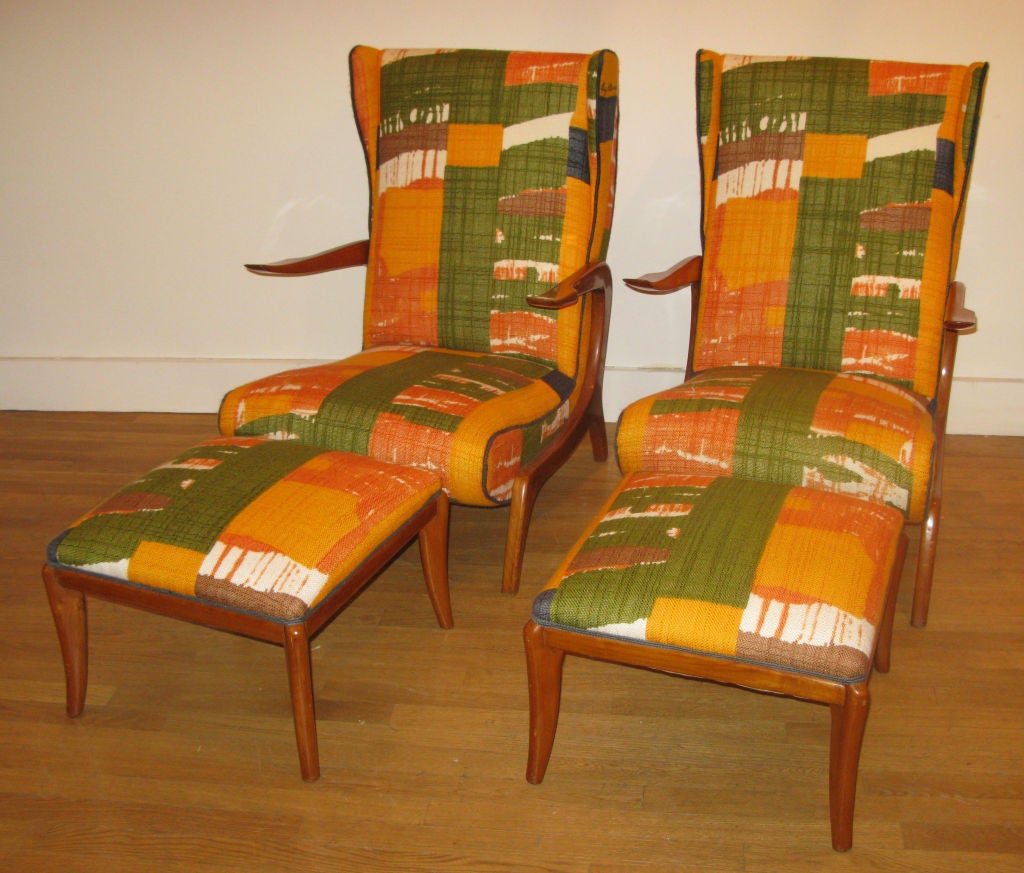 Pair of Italian 1950's Wood Framed Arm Chairs with Matching Ottomans.  Chairs are in Newly Upholstered in Original 1960's Woven Fabric with Signature on Top Rights of Chairs.  Low, Lounge Shape to chairs give a 'recliner' feel when paired with