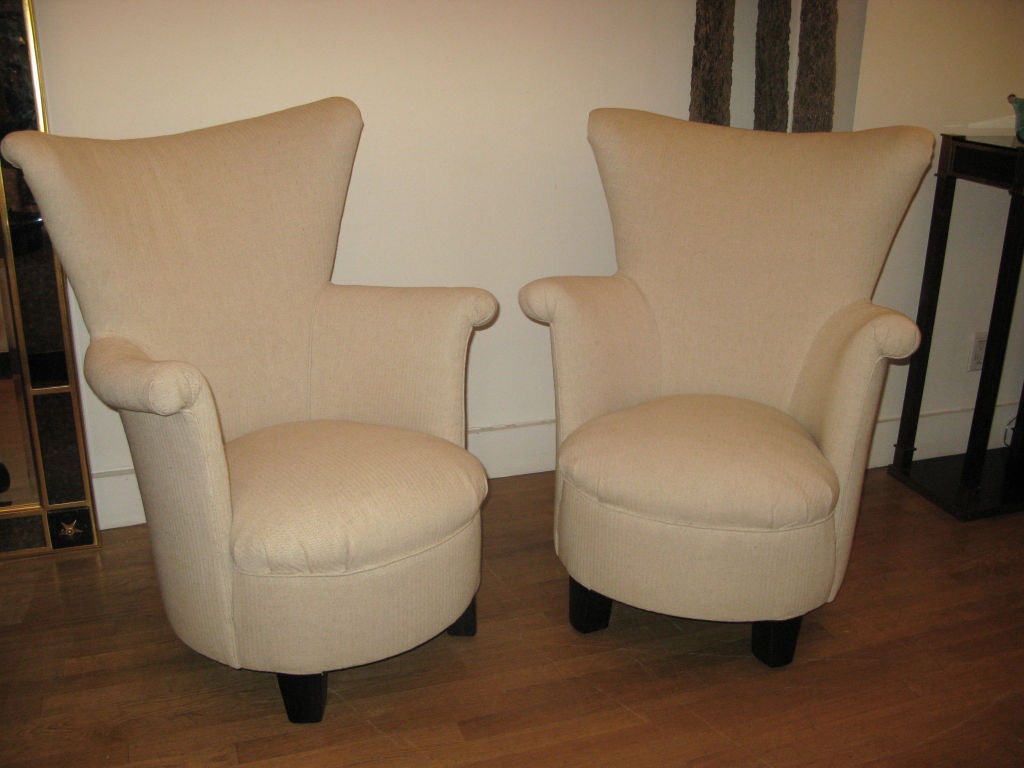 Pair of Mid-Century Modern Italian Wingback Chairs.  Circular 'tub' seat and high winged back rest on mahogany block feet.  Newly upholstered in herringbone textured heavyweight linen.