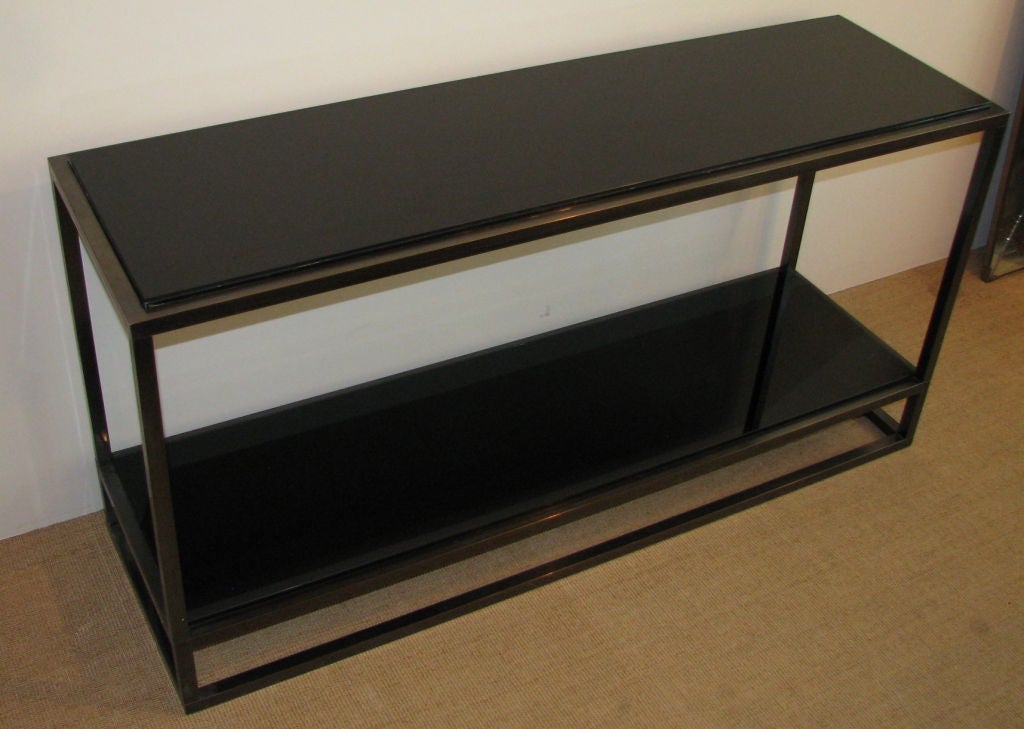 A Jansen French Black Glass Two Tiered Iron Console.