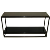 A Jansen French Black Glass Two Tiered Iron Console.