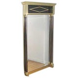 A tall and stylish french Maison Jansen style brass mirror