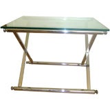 A rectangular chrome and brass coffee table