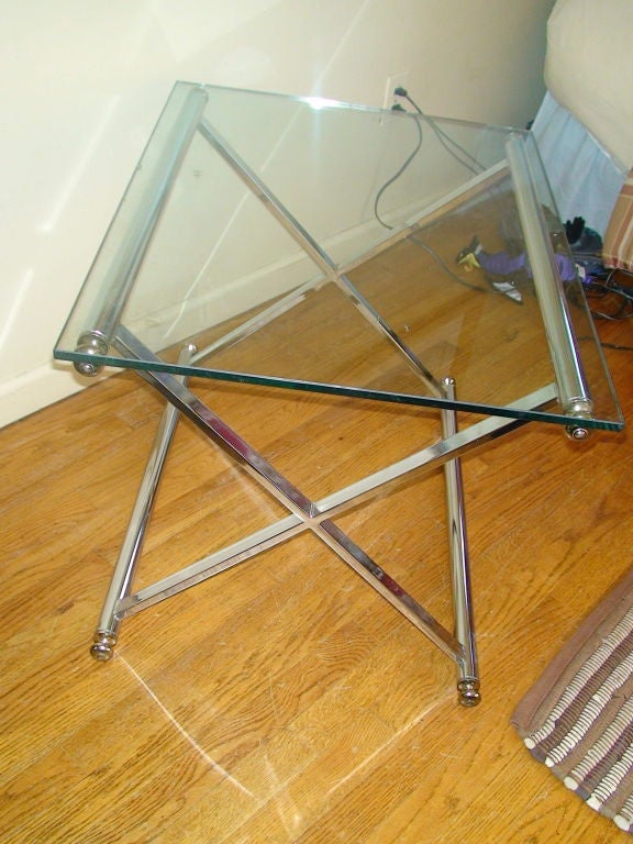 A rectangular chrome and brass coffee table