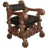 An Exuberantly Carved Italian Baroque Style Giltwood Throne Chair