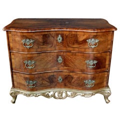 A Curvaceous German Rococo Walnut-Veneered and Parcel-Gilt Serpentine 3-Drawer Commode