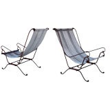 A Curvaceous Pair of American Wrought Iron Sling-Back Armchairs