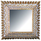 A Radiating Italian Baroque Style Carved Giltwood Square Mirror