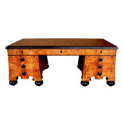 A Massive and Good Quality German Biedermeier Style 9-Drawer Birch Wood Pedestal Desk with Ebonized Highlights