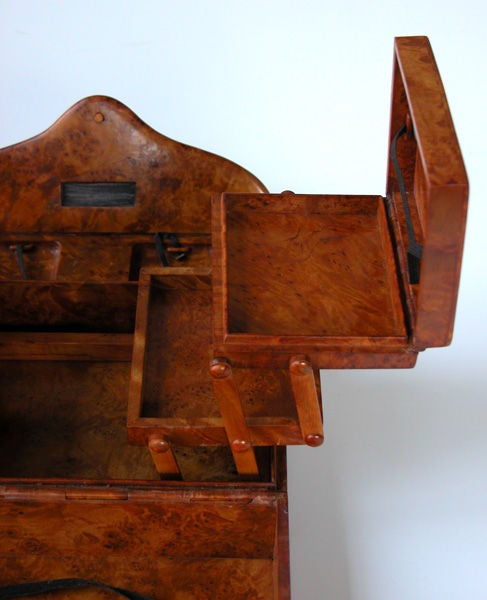 A rare French art deco thuya wood folding himidor with wooden hinges; the shaped clasp with wooden hinge opening to reveal 2 extending humidors, a match strike and match compartments; made completely with wooden hinges