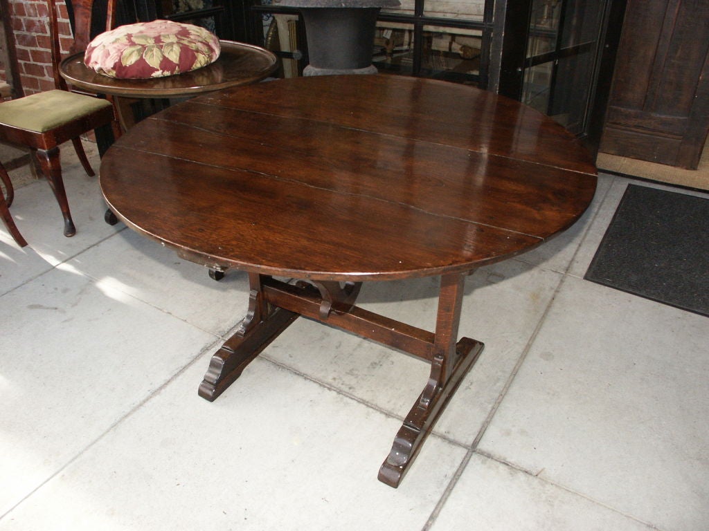 Great looking antique flip top table that has been raised and made stationary.  This has a great patina and the raised base has made it more functional.   This can work as a game table or breakfast or coffee table