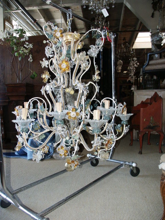 Nice looking large unusual combination blown venetian glass and gilt iron with scrolling leaves and beading