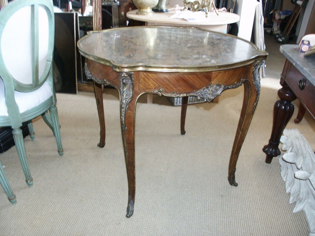 Beautiful antique French ormolu mounted marble topped Louis XV center table or end table.