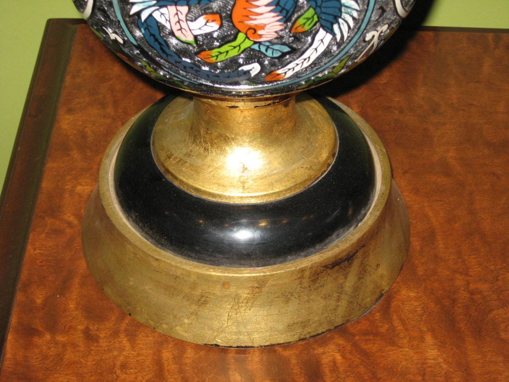 Pair of French champleve (reverse cloisonne) table lamps in hand painted bronze with gilded wooden base. Colors are navy, red, green, pink and pale blue.