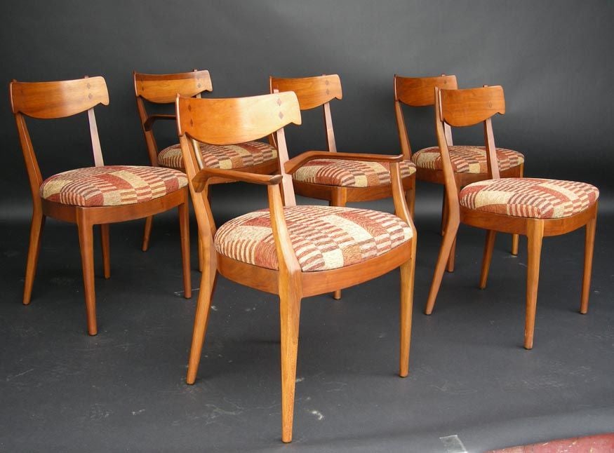 Mid century Drexel Declaration dining set designed by Stewart MacDougall. Table plus two arm chairs and 4 side chairs. Table has two 22