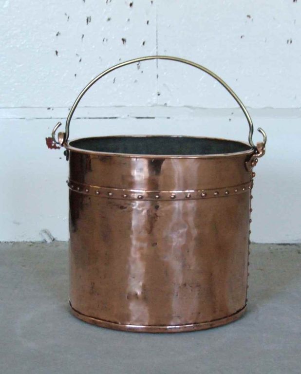 Early 19th Century hand forged copper apple kettle with studded rivet work, brass carrying handle.

firewood, kindling, log holder