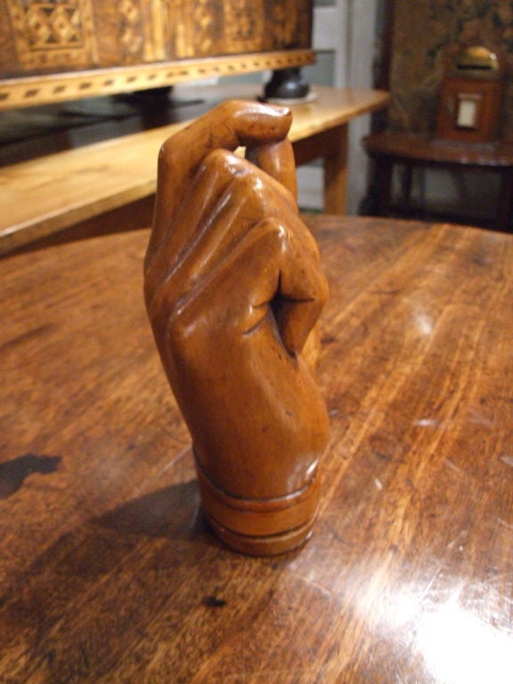 Whimsical 19th century English treen fruitwood snuff box in the form of a human hand holding a pinch of snuff.