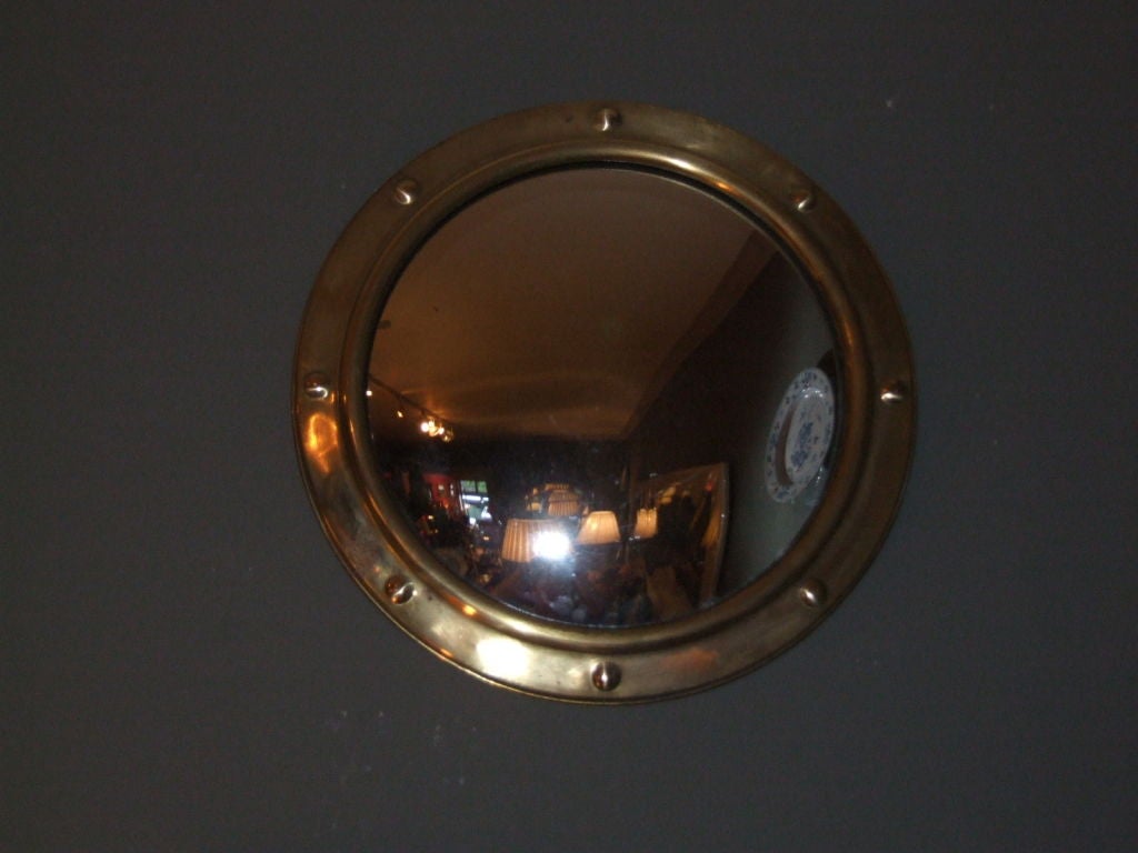 Collection of five 20th c. English porthole mirror with convex plate having decorative brass rim with stud work decoration.