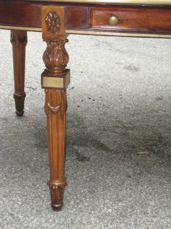 English Unusual brass-inlaid oval library table