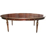Unusual brass-inlaid oval library table