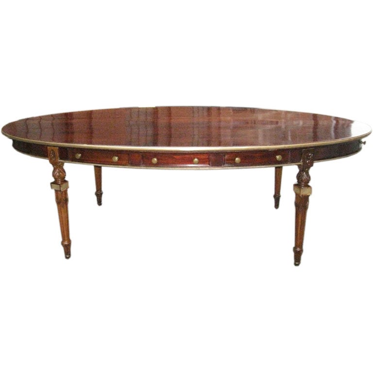 Unusual brass-inlaid oval library table