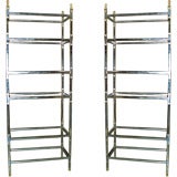 A pair of chrome and gilt-iron etageres with 6 shelves