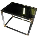 A pair of modern chrome and brass glass-top tables A pair of modern chrome and brass glass-top tables