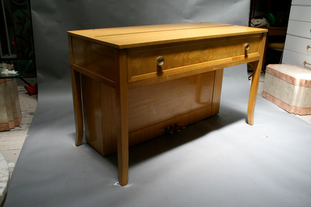 Bleached walnut with decorative flourishes reminiscent of Robsjohn. Manufactured by Gulbransen