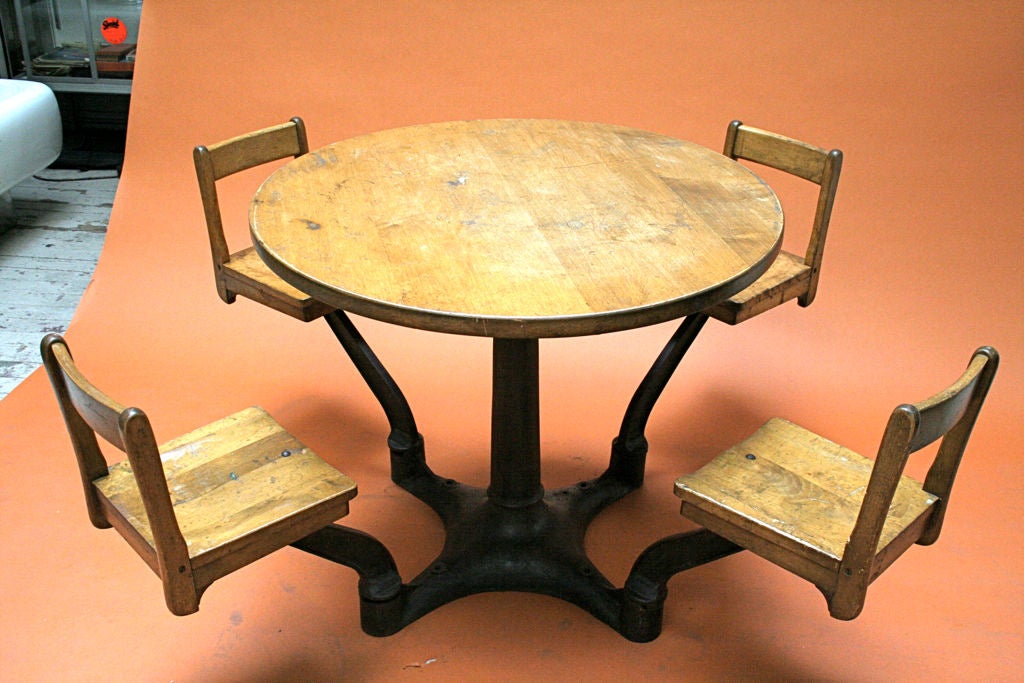 Very rare form, made to bolt to floor.<br />
<br />
Diameter with chairs out: 64
