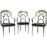Three Cast Aluminum Chairs with a Fanciful Line Three Cast Aluminum Chairs with a Fanciful Line