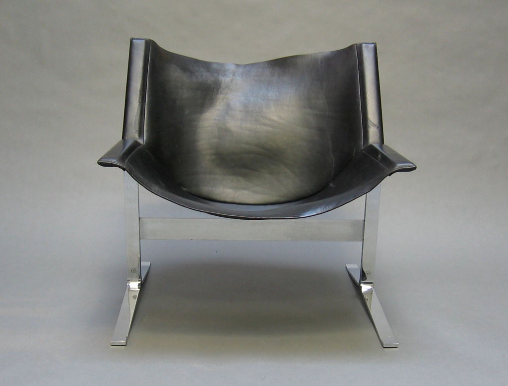 Pair of steel and leather sling chairs designed by Clement Meadmore