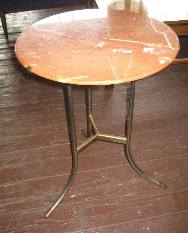 Rare matching pair of Hartman's Classic side table, in red marble, with an unusual mixed chrome and brass base. The brass center stretcher forms an exposed tenon on each of the brass-tipped chrome legs. Nice patina. Stamped on underside of each