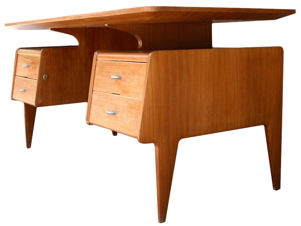 Gorgeous cherry wood desk with beveled plateau and steel hardware; finished all around. Attributed to Gugielmo Ulrich.