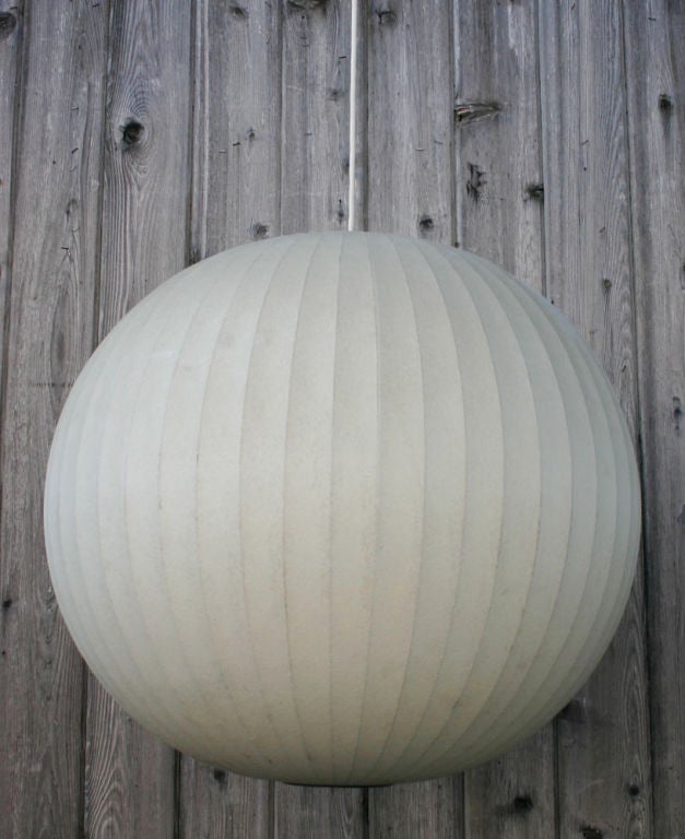 Large wire frame globe with flocked, sprayed resin shade.