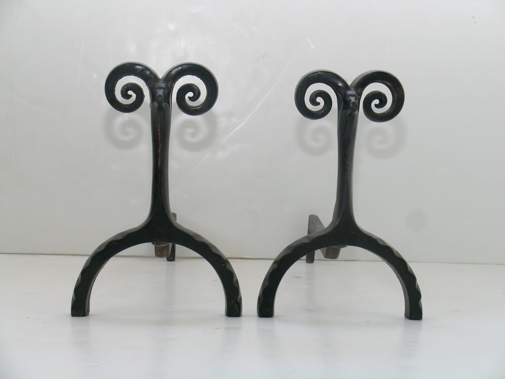 Pair of rams head andirons in bronze by Peter Kilham.