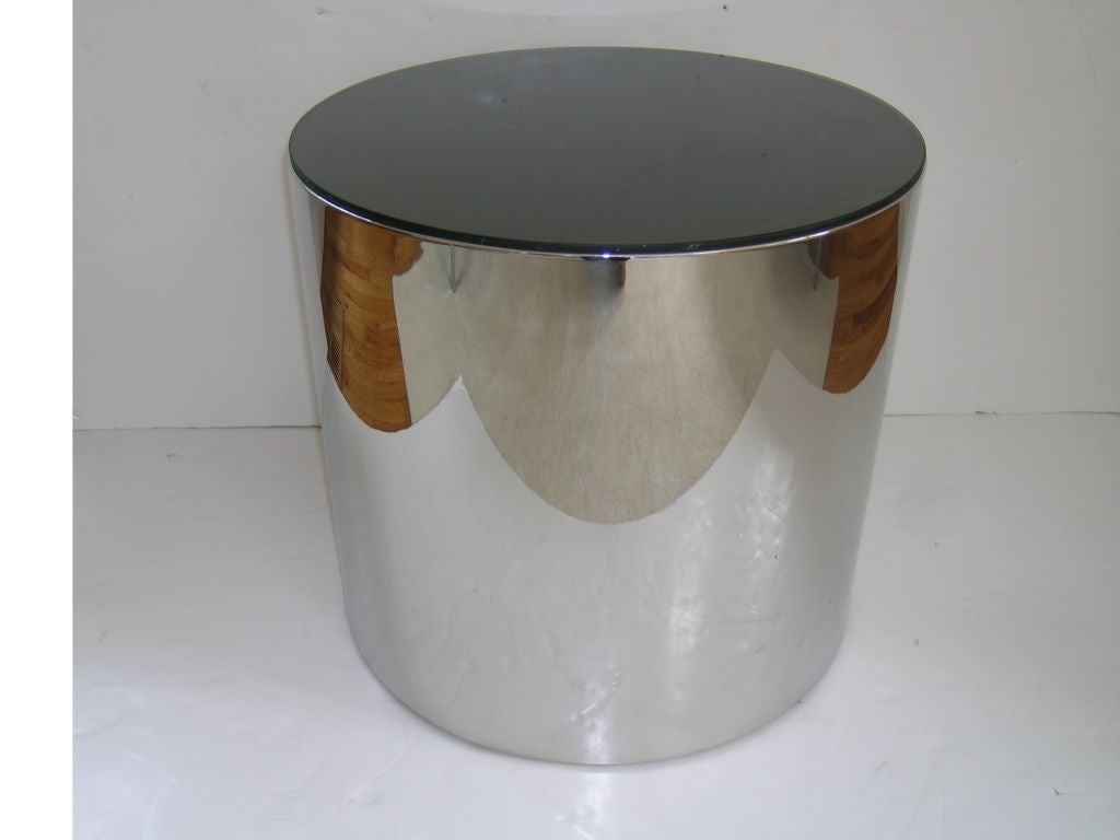 Canister end tables in heavy guage stainless and smoke glass.