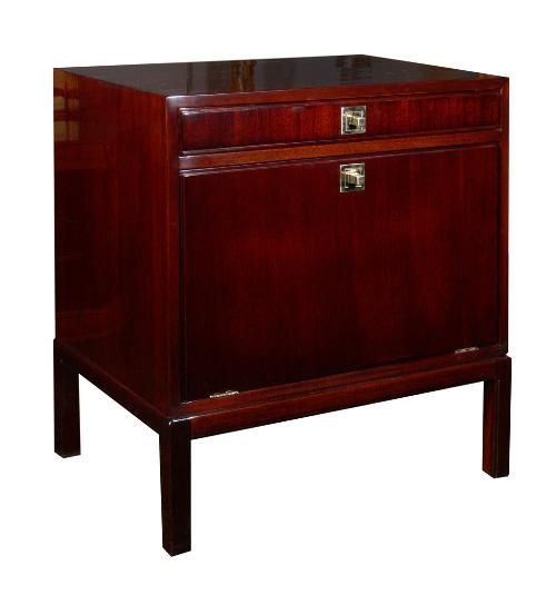 Mahogany cabinet by Tommi Parzinger for Charak Modern, circa 1950. Single drawer over a flip down door. Solid brass pulls with Parzingers' signature detailing. Beautiful hand rubbed French polish finish. A perfect side or end table. Signed with