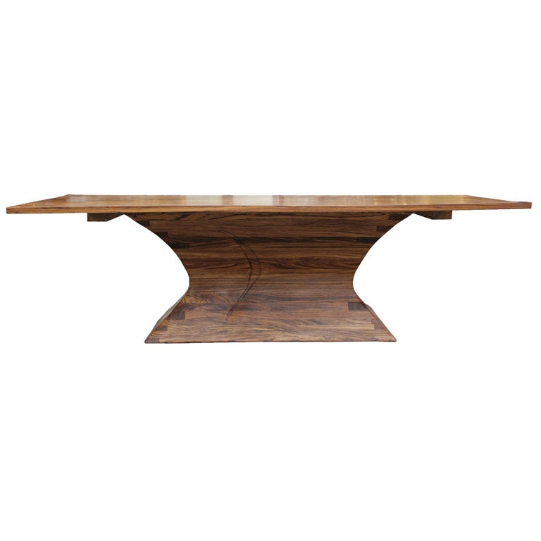 Magnificent dining table in zebrawood by Richard Rothbard. Solid 1.25<br />
inch zebrawood top rests on a flared, stepped base of stack laminate<br />
zebrawood. A unique commission, large scale furniture by Rothbard is<br />
exceptionally rare.