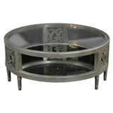 A Round silver leaf cocktail table by James Mont