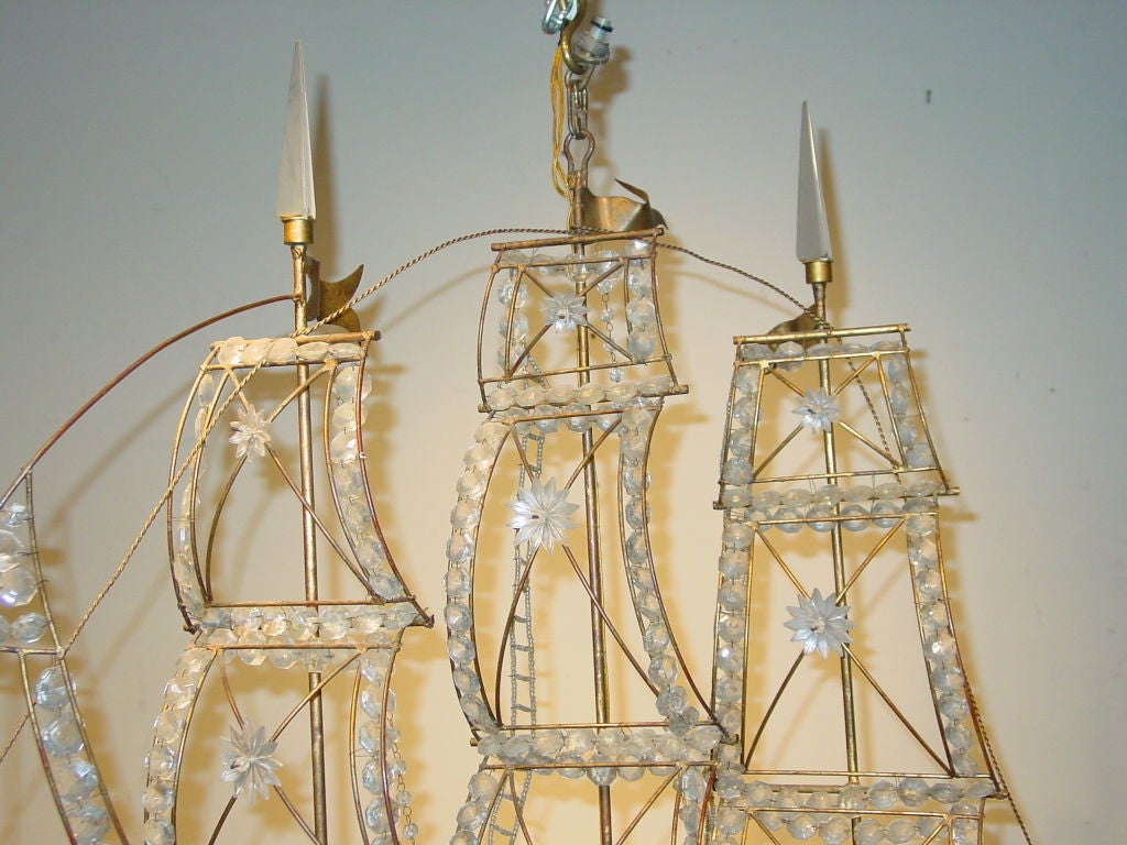 French A Whimsical Gilt-Metal Chandelier, in the manner of Baguès