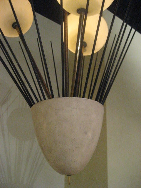 A rare Arredoluce chandelier with three opaline/yellow plastic shades.