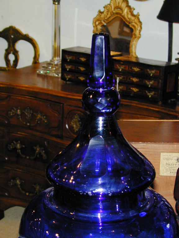Pair of 19th century etched and cut blue glass liquor dispensers