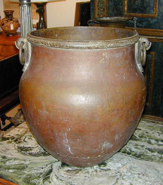 19th century Indian hand hammered copper urn with bronze bird form ringed handles with rich antique patina.