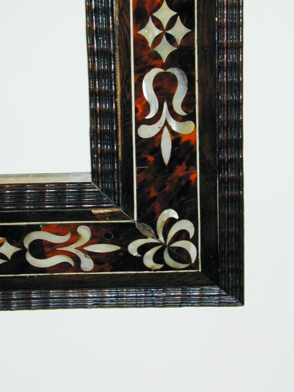 Unusual 18th century Hispano Flemish frame. The tortoiseshell and mother of pearl inlay showing the Spanish influence and the ripple molding typically Dutch, circa 1700.