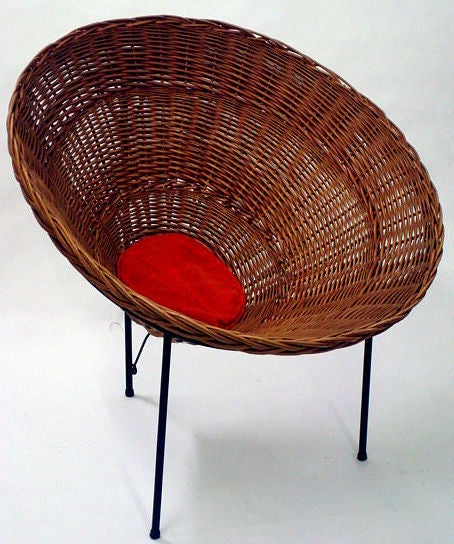 'Sunflower', a conical form woven wicker basket lounge chair with a single button pillow cushion raised on a three leg wrought iron frame. By architect Roberto Mango for Tecno. Distributed by Allan Gould Designs. Italy, circa 1950. [DUF0339]