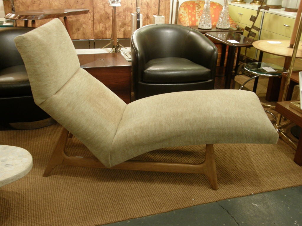 A chaise lounge raised on an sculpted open form wood frame by Harvey Probber. American, circa 1950.