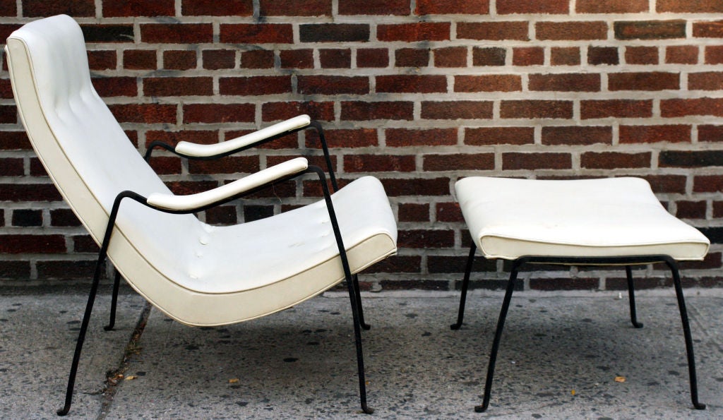A Modernist high back scoop lounge chair and ottoman with wrought iron frame, sling style arm rests, and turned out feet by Milo Baughman for Thayer Coggin. U.SA., circa 1950. [DUF0525]