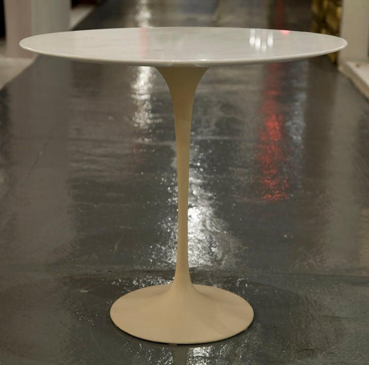 A fine early example of an oval Italian Carrara, Calacatta marble top and off-white enameled tulip pedestal base cigarette side table, model. no. 161, by Eero Saarinen for Knoll Associates. U.S.A., circa 1957.