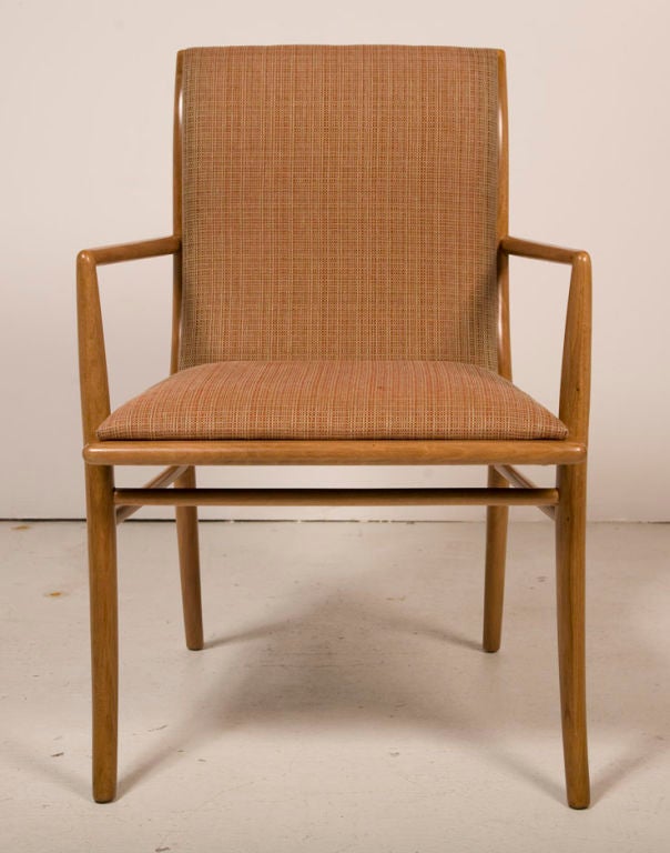 A fine set of 12 sabre leg dining chairs in walnut frames and upholstered seats and backs, model. no. 4204 (side and arm chairs) by T.H. Robsjohn-Gibbings for Widdicomb. U.S.A., circa 1950. Price COM.