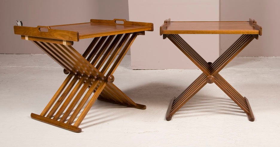 A pair of walnut campaign tables with removable trays and folding scissor bases. Mod. no. 881-401, from the Declaration Line by Stewart MacDougall and Kipp Stewart for Drexel Furniture Company. American, circa 1960.