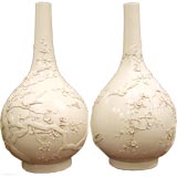 A Pair Of White Porcelain Vases With Applique Motif